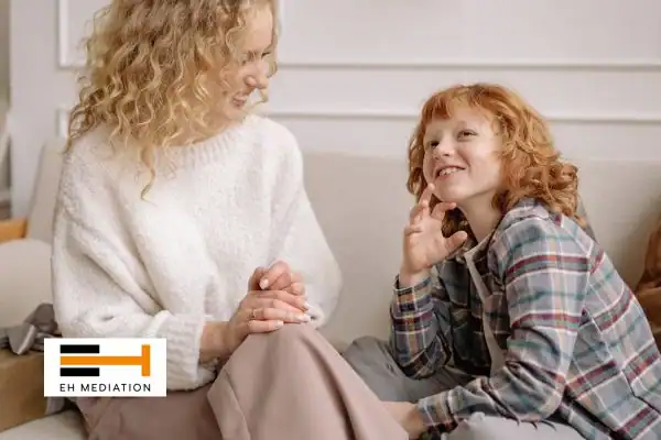 Happy mother and child after sorting child arrangements mediation Swinton